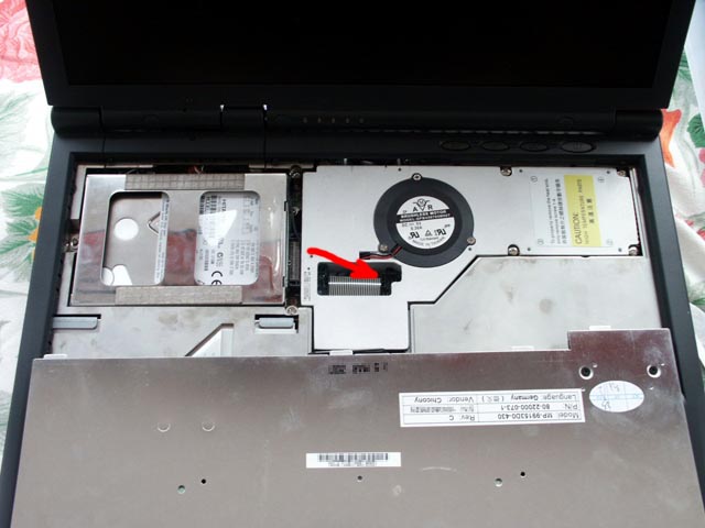 The red arrow marks the location of the BIOS battery
