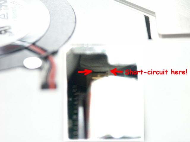The red arrows show the place where you should short-circuit the BIOS battery with a screwdriver.